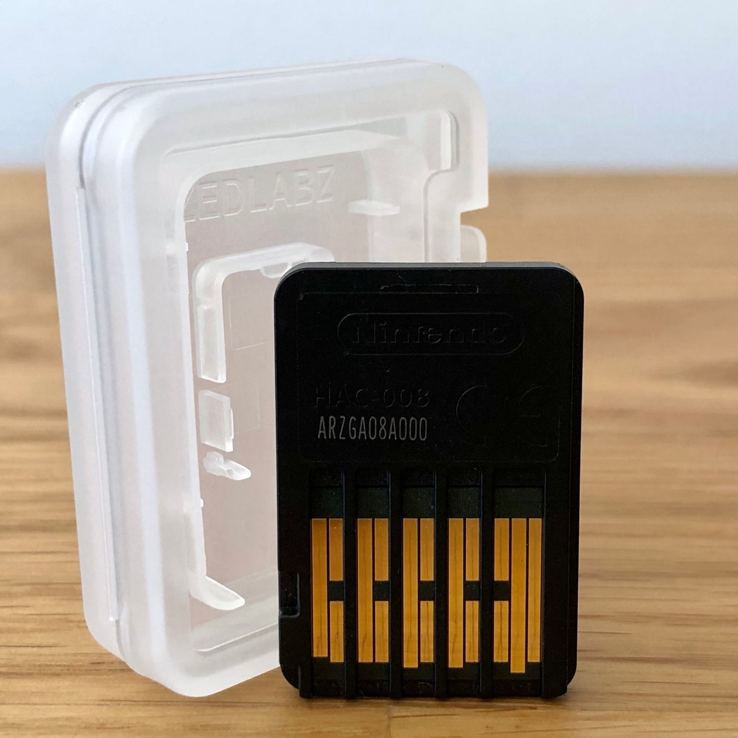 Back of the Kirby and the Forgotten Land game cartridge for Nintendo Switch, showing connector pins and cartridge shape.
