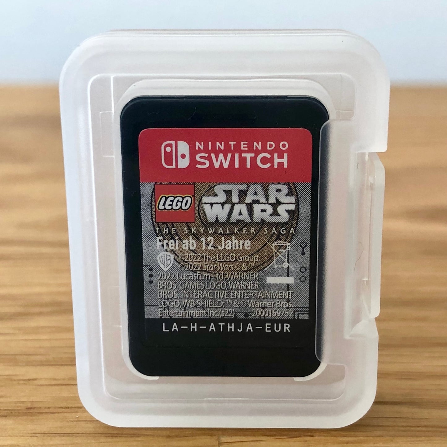 LEGO Star Wars: The Skywalker Saga Nintendo Switch cartridge inside a transparent protective case, showing the front label through the plastic.