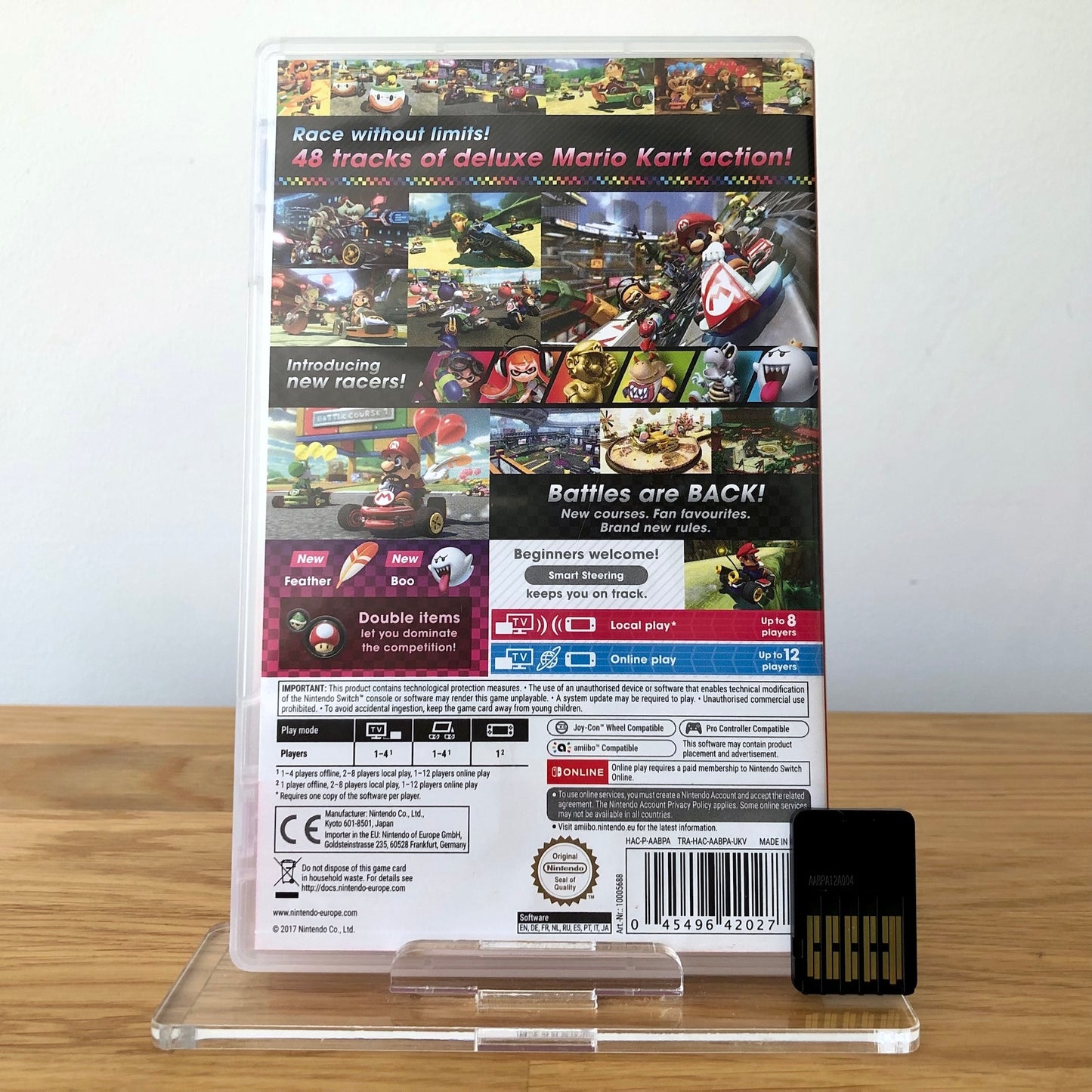 Back cover of Mario Kart 8 Deluxe for Nintendo Switch, showing game details, features, and back of cartridge.