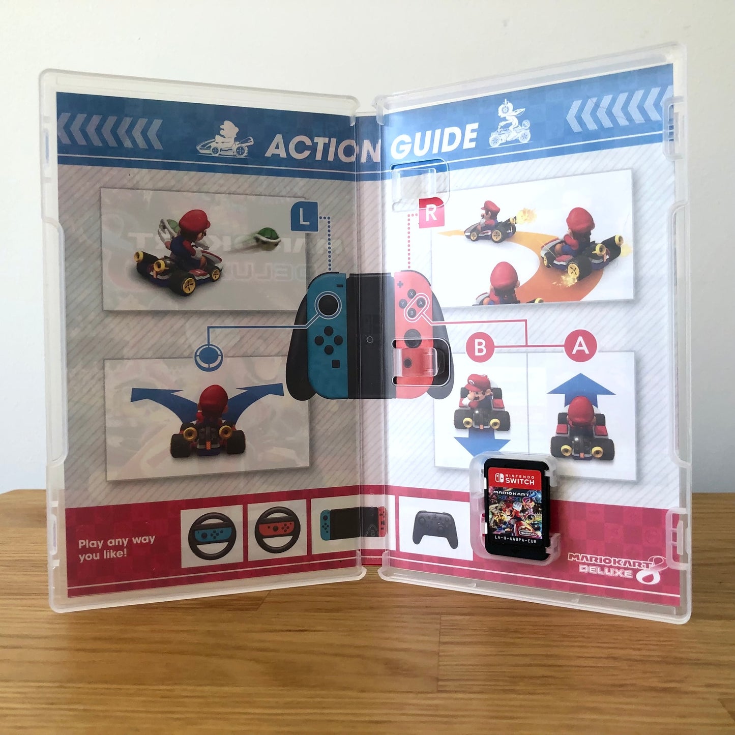 Inside the case of Mario Kart 8 Deluxe for Nintendo Switch, showing the cartridge and case design.