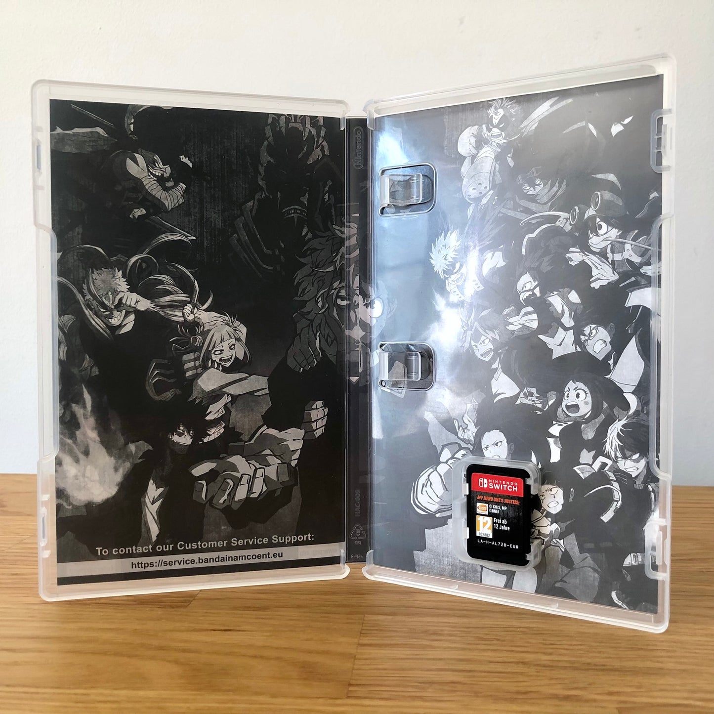 Inside the case of My Hero One’s Justice for Nintendo Switch, showing the cartridge and case design.