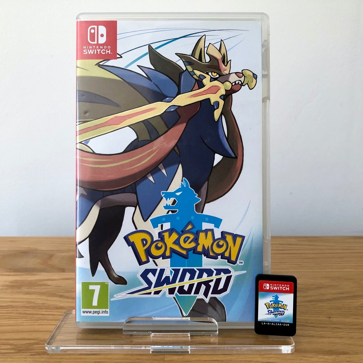 Front cover of Pokémon Sword for Nintendo Switch, featuring game artwork, title, and front of cartridge.
