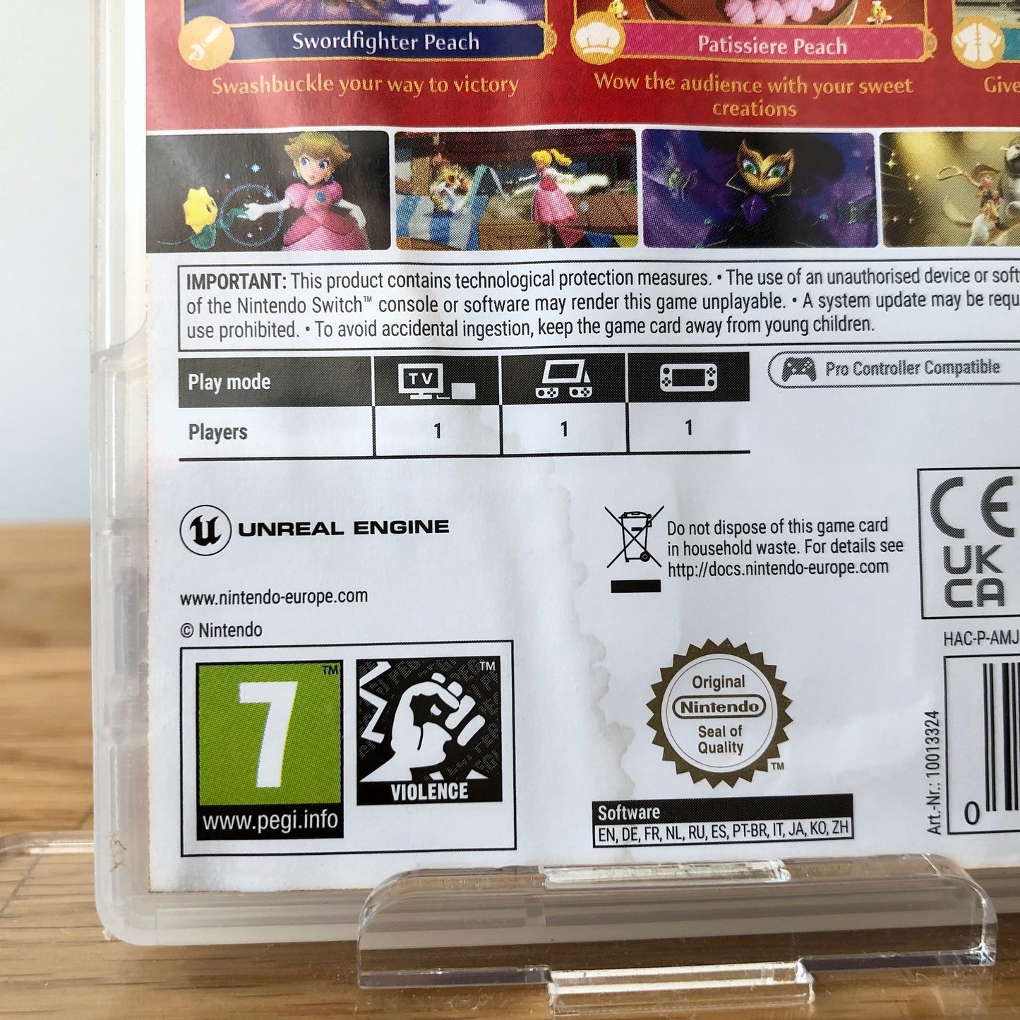 Back cover of Princess Peach Showtime! for Nintendo Switch, showing small watermark discolouration in the lower left-hand section