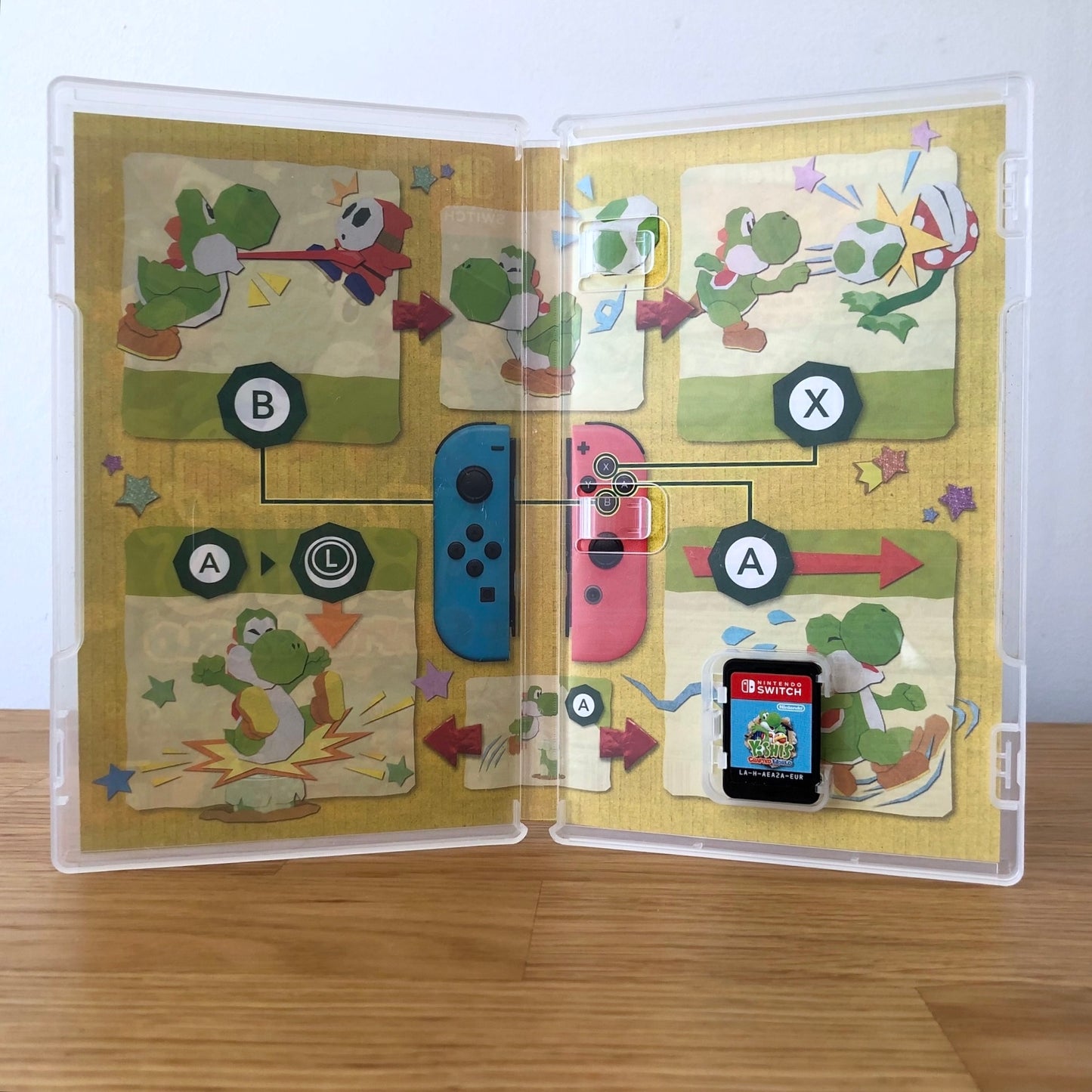 Inside the case of Yoshi's Crafted World for Nintendo Switch, showing the cartridge and case design.