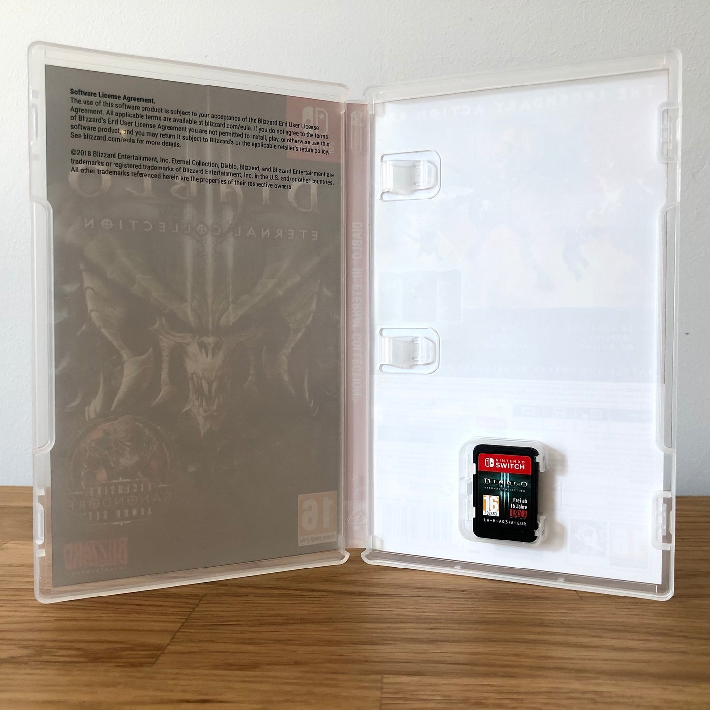 Inside the case of Diablo III: Eternal Collection for Nintendo Switch, showing the cartridge and case design.