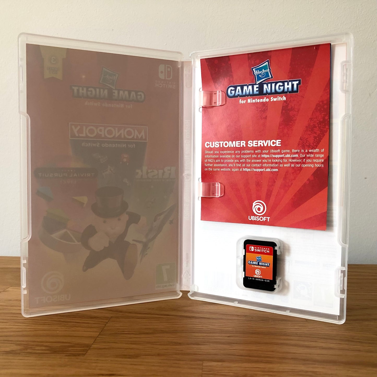 Inside the case of Hasbro Game Night for Nintendo Switch, showing the cartridge and case design.