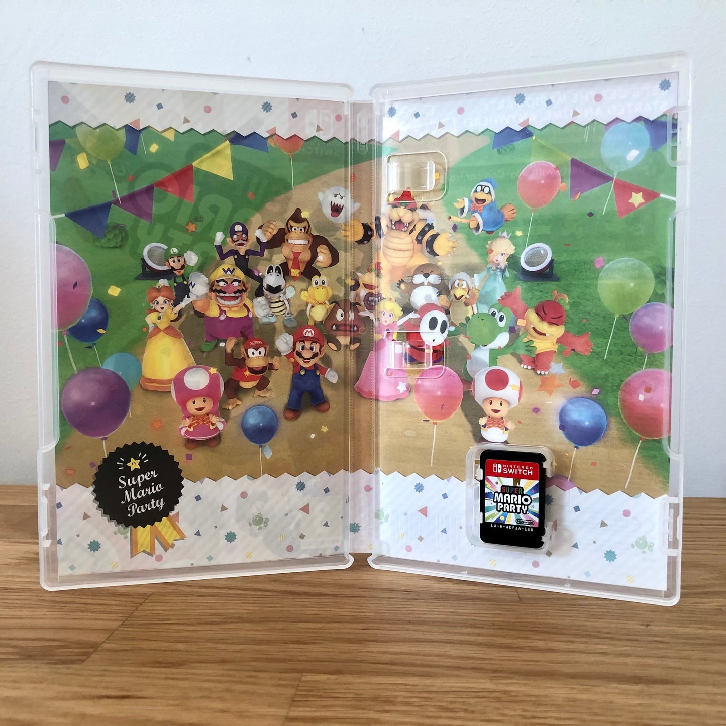 Inside the case of Super Mario Party for Nintendo Switch, showing the cartridge and case design.
