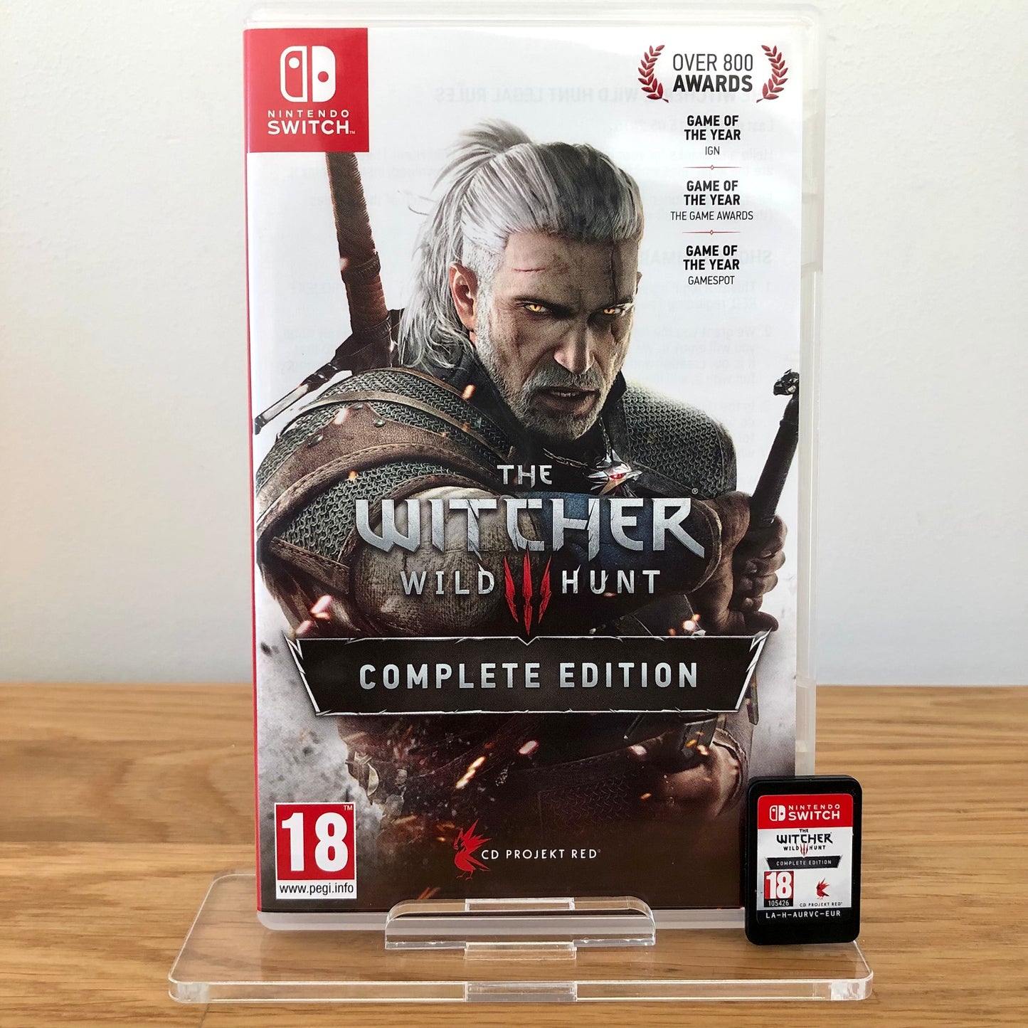 Front case cover of The Witcher 3: Wild Hunt Complete Collection for Nintendo Switch, featuring game artwork, title, and front of cartridge.