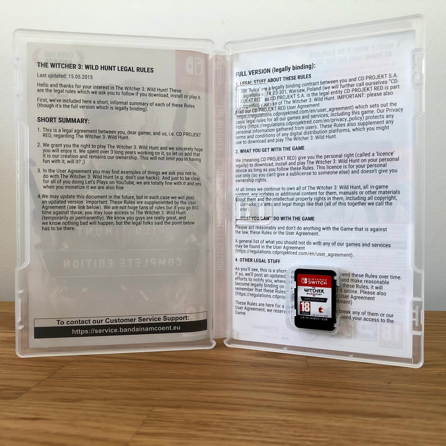 Inside the case of The Witcher 3: Wild Hunt Complete Collection for Nintendo Switch, showing the cartridge and case design.