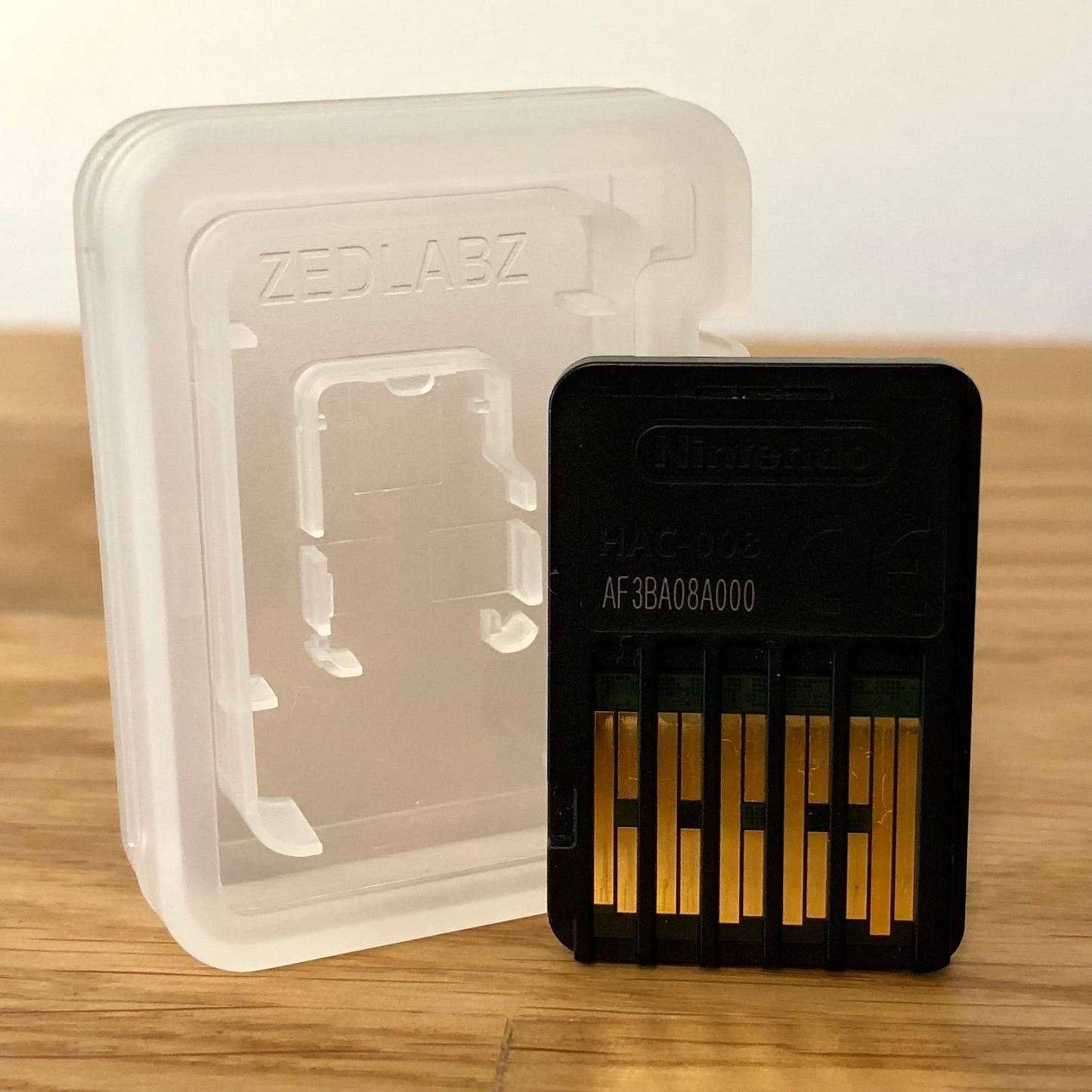 Cartridge back of DOOM for Nintendo Switch, showing data pins.