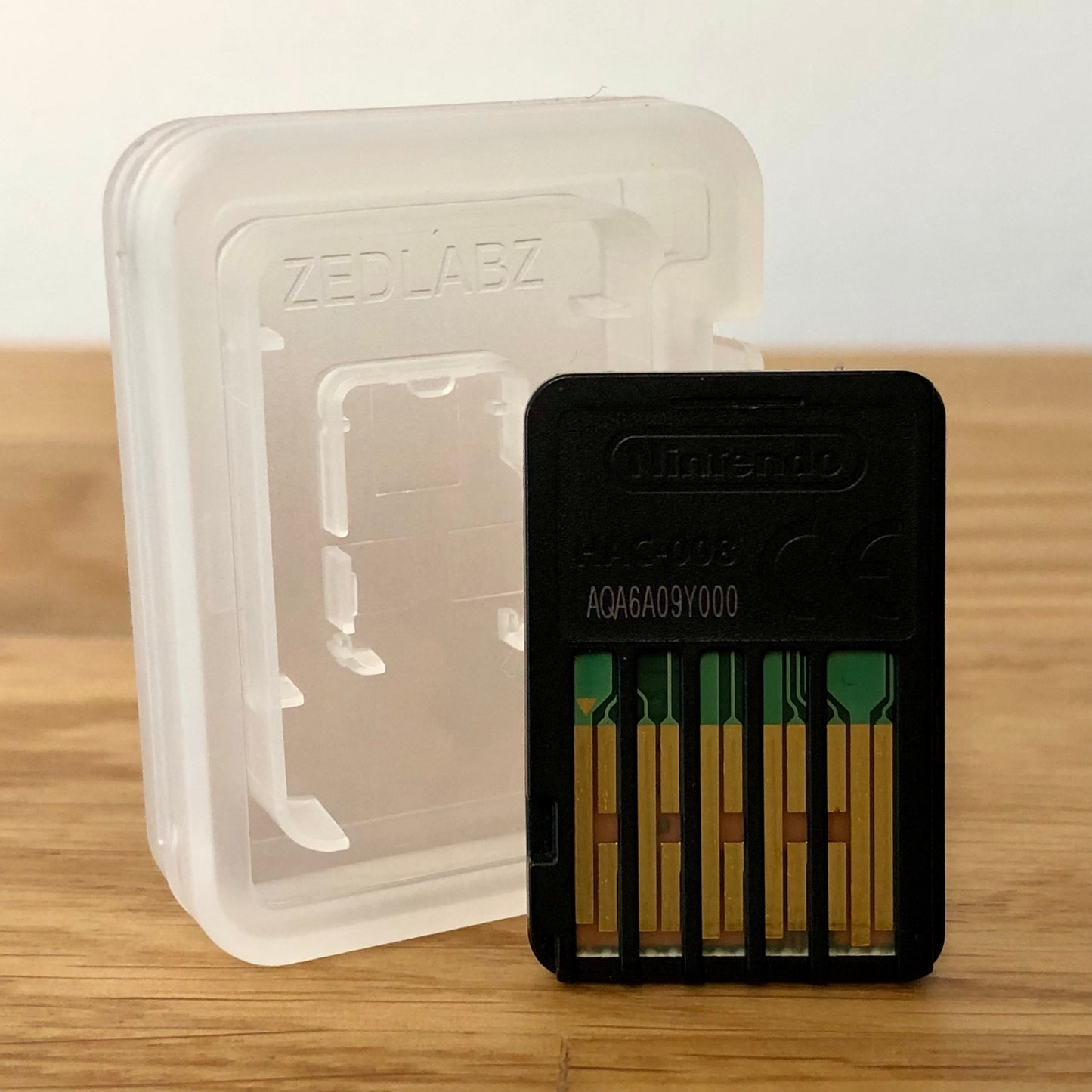 Cartridge back of Hello Neighbor for Nintendo Switch, showing data pins.