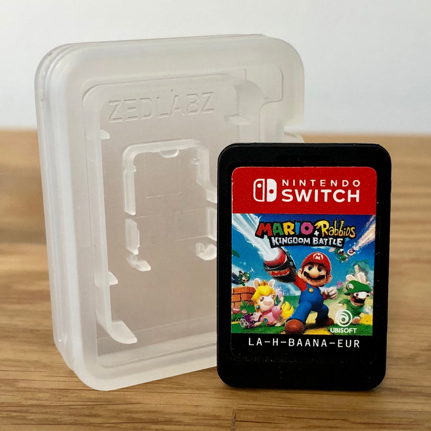 Cartridge front of Mario + Rabbids Kingdom Battle for Nintendo Switch, featuring game title.