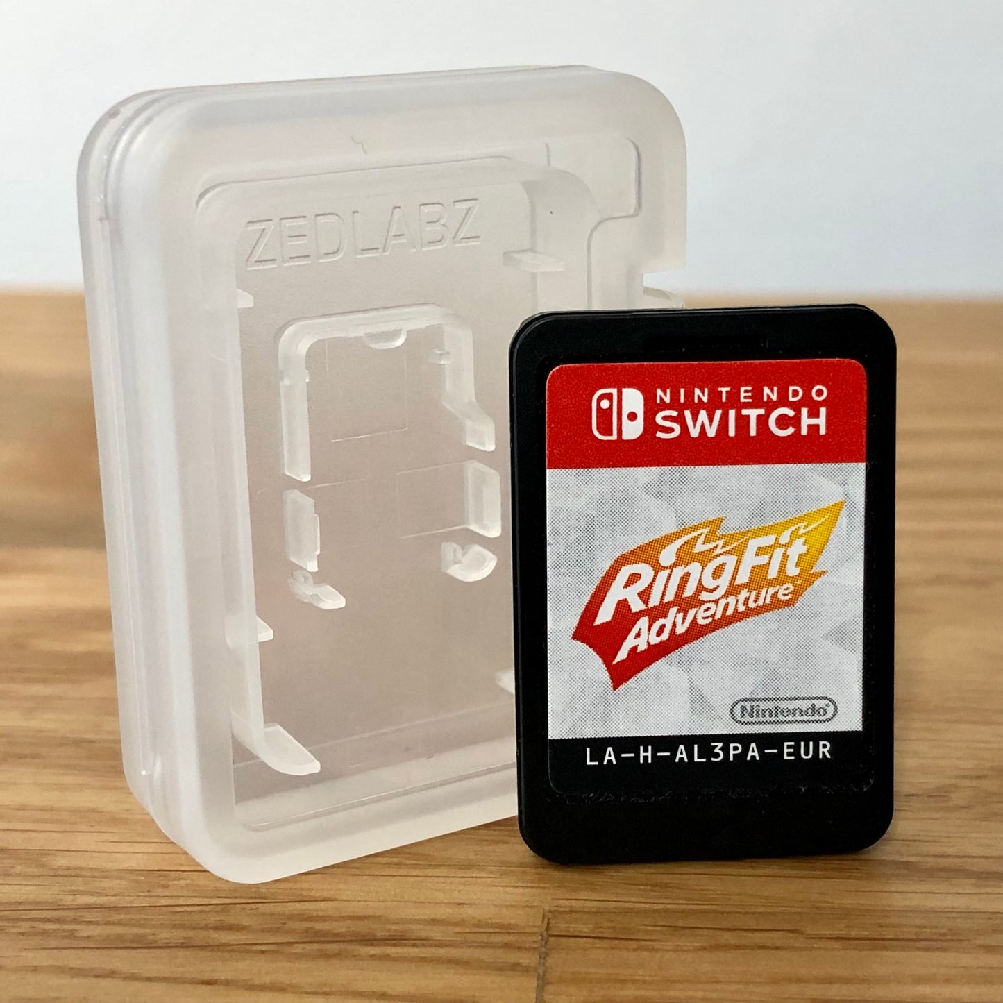 Cartridge front of Ring fit adventure for Nintendo Switch, featuring game title.