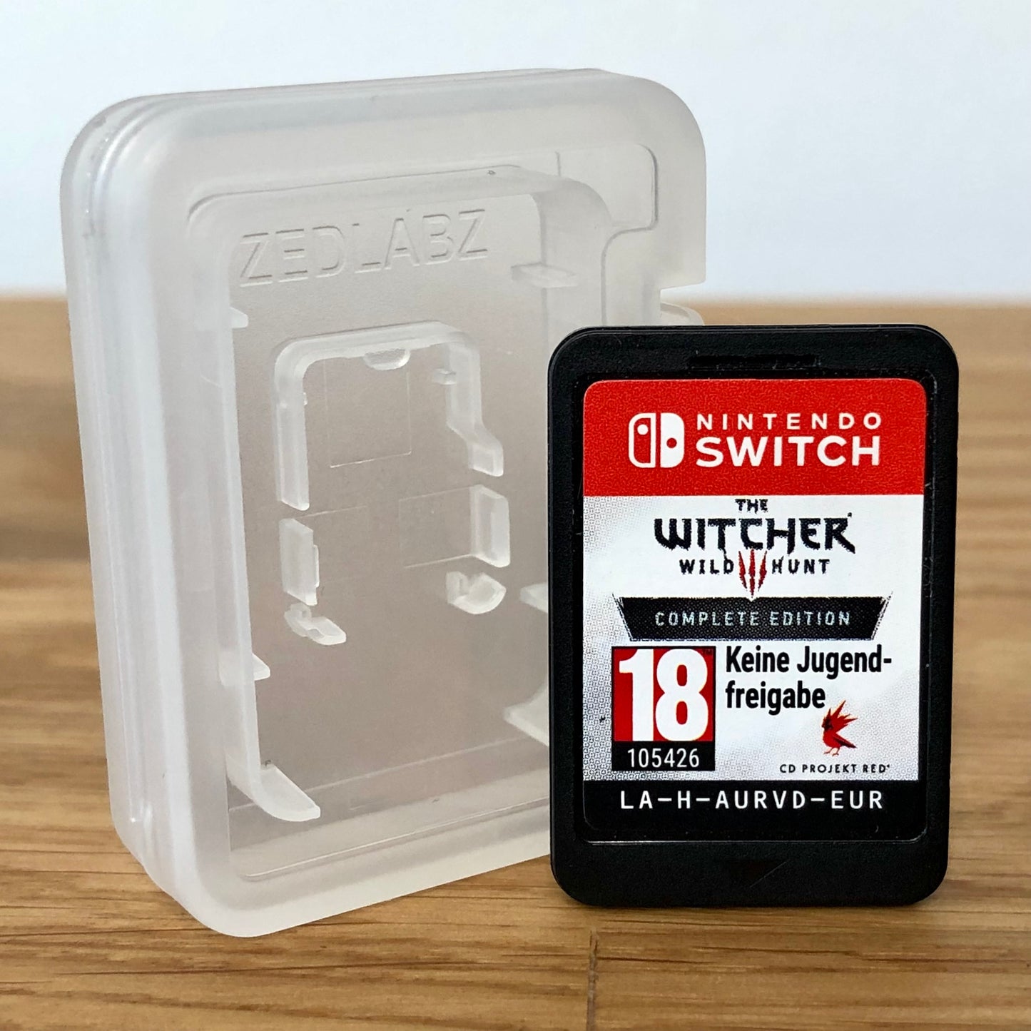 Cartridge front of The Witcher 3: Wild Hunt Complete Collection for Nintendo Switch, featuring game title.