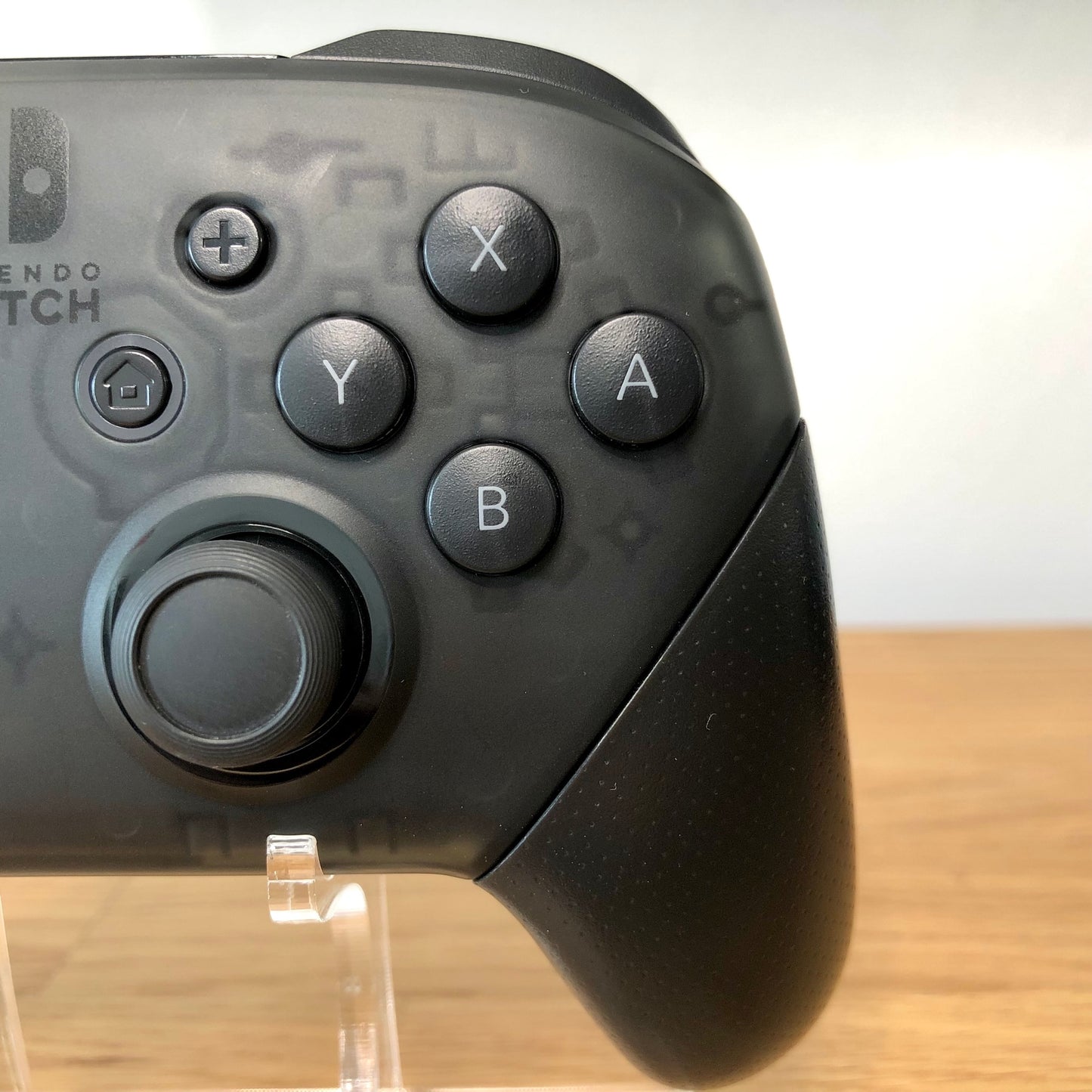 Close up view of Nintendo Switch Pro Controller right side, highlighting the right side buttons condition.