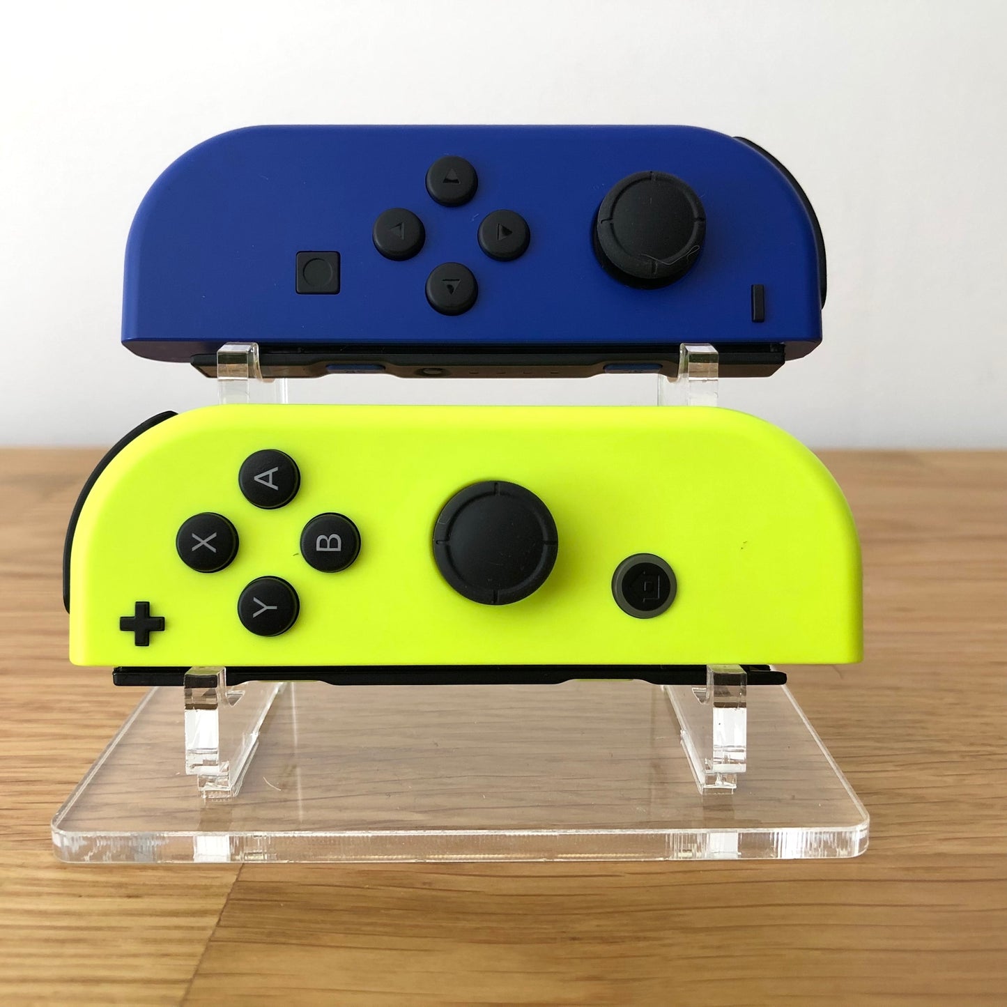 Front view of Blue & Neon Yellow Joy-Cons pair, showing button layout and design.