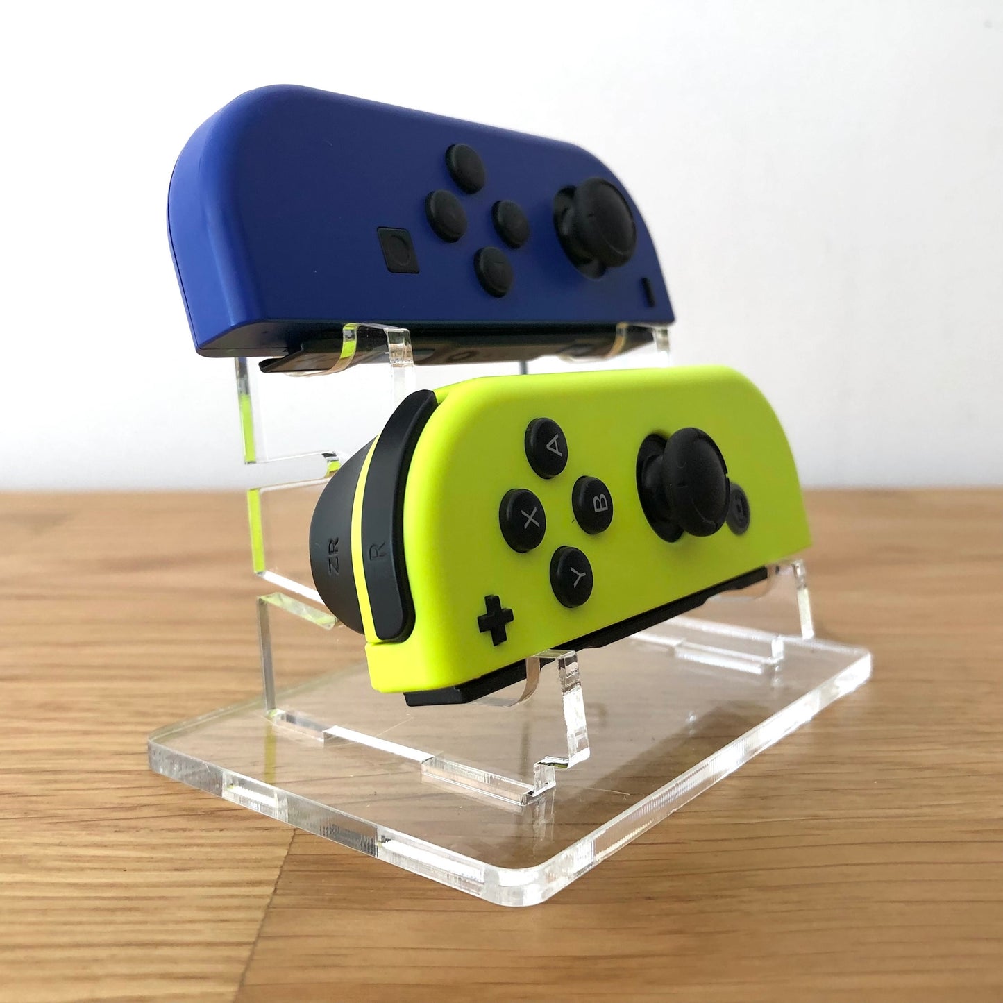 Front side view of Blue & Neon Yellow Joy-Cons pair, showing button layout and design.