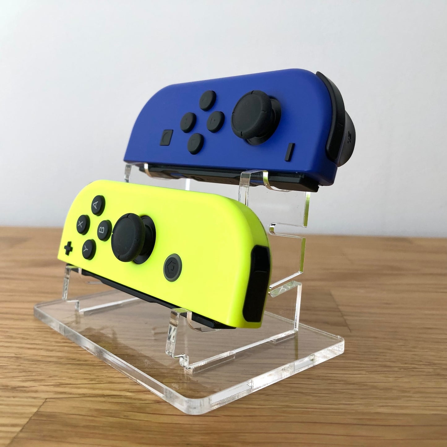 Front side view of Blue & Neon Yellow Joy-Cons pair, showing button layout and design.