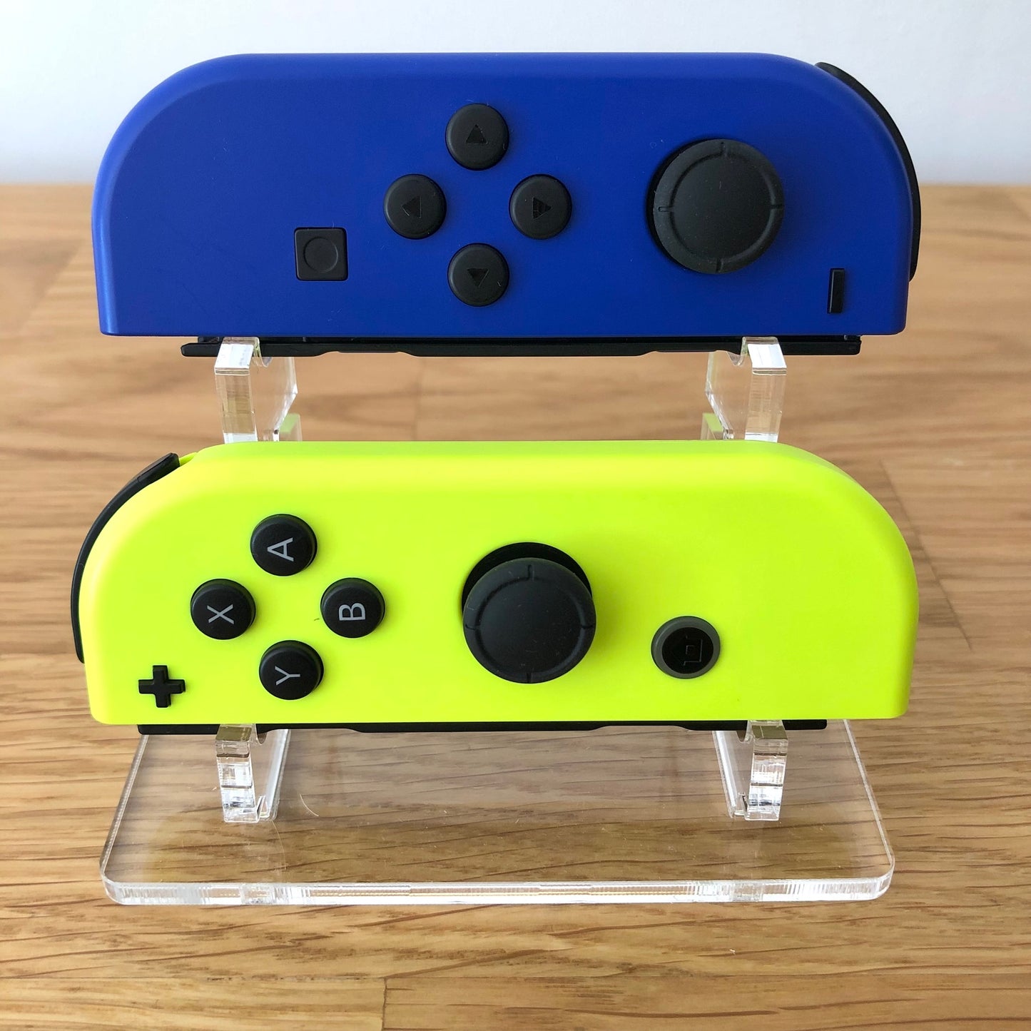 Front view of Blue & Neon Yellow Joy-Cons pair, showing button layout and design.