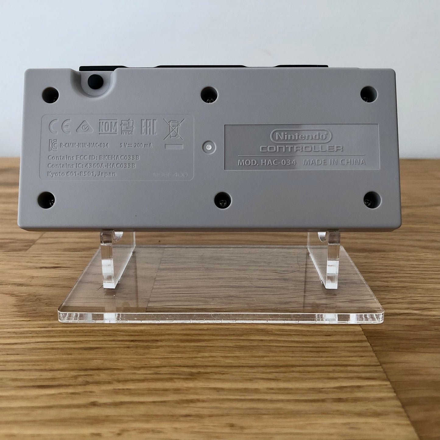 Back view of Nintendo Switch NES Online Controller, highlighting model details and rear design.