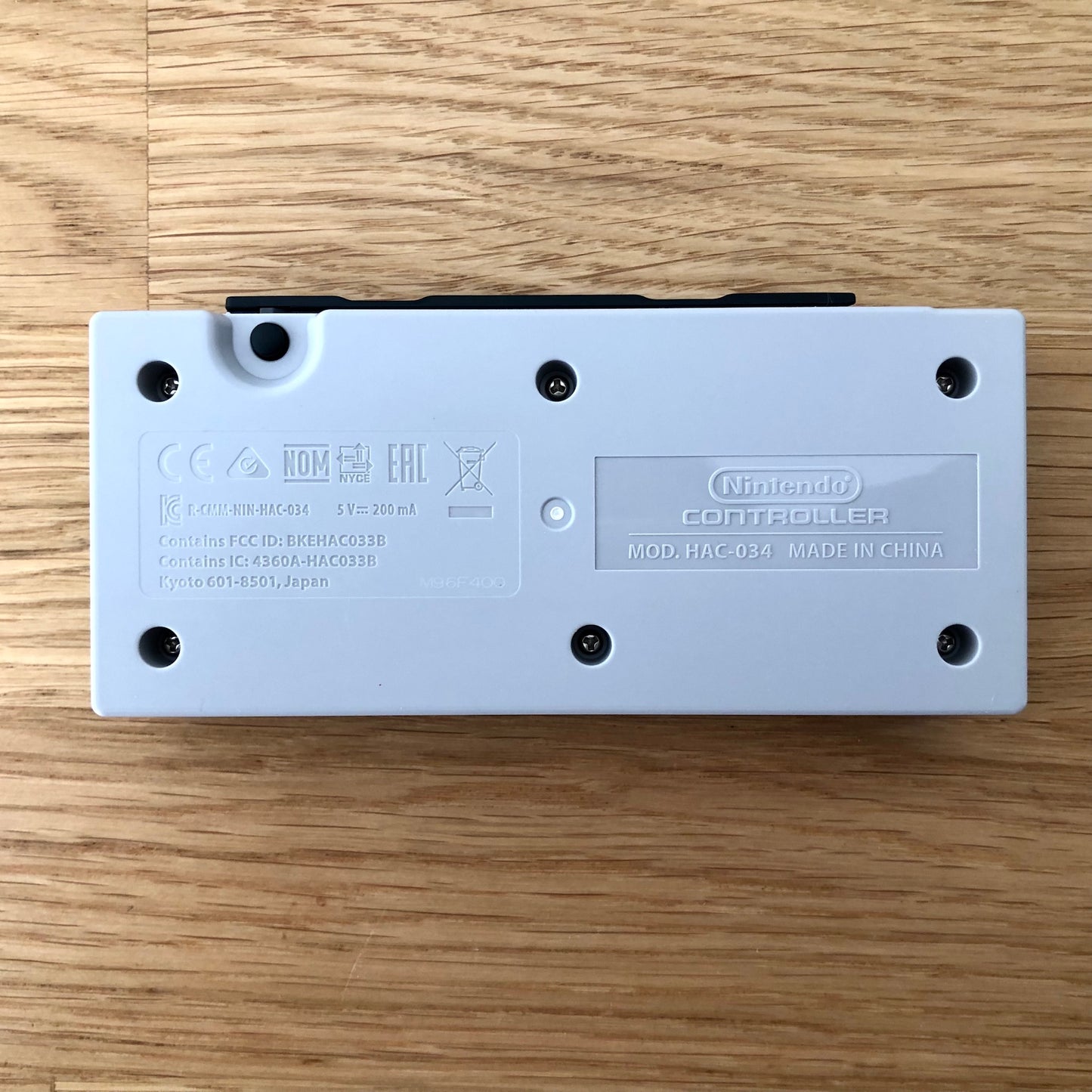 Back view of Nintendo Switch NES Online Controller, highlighting model details and rear design.