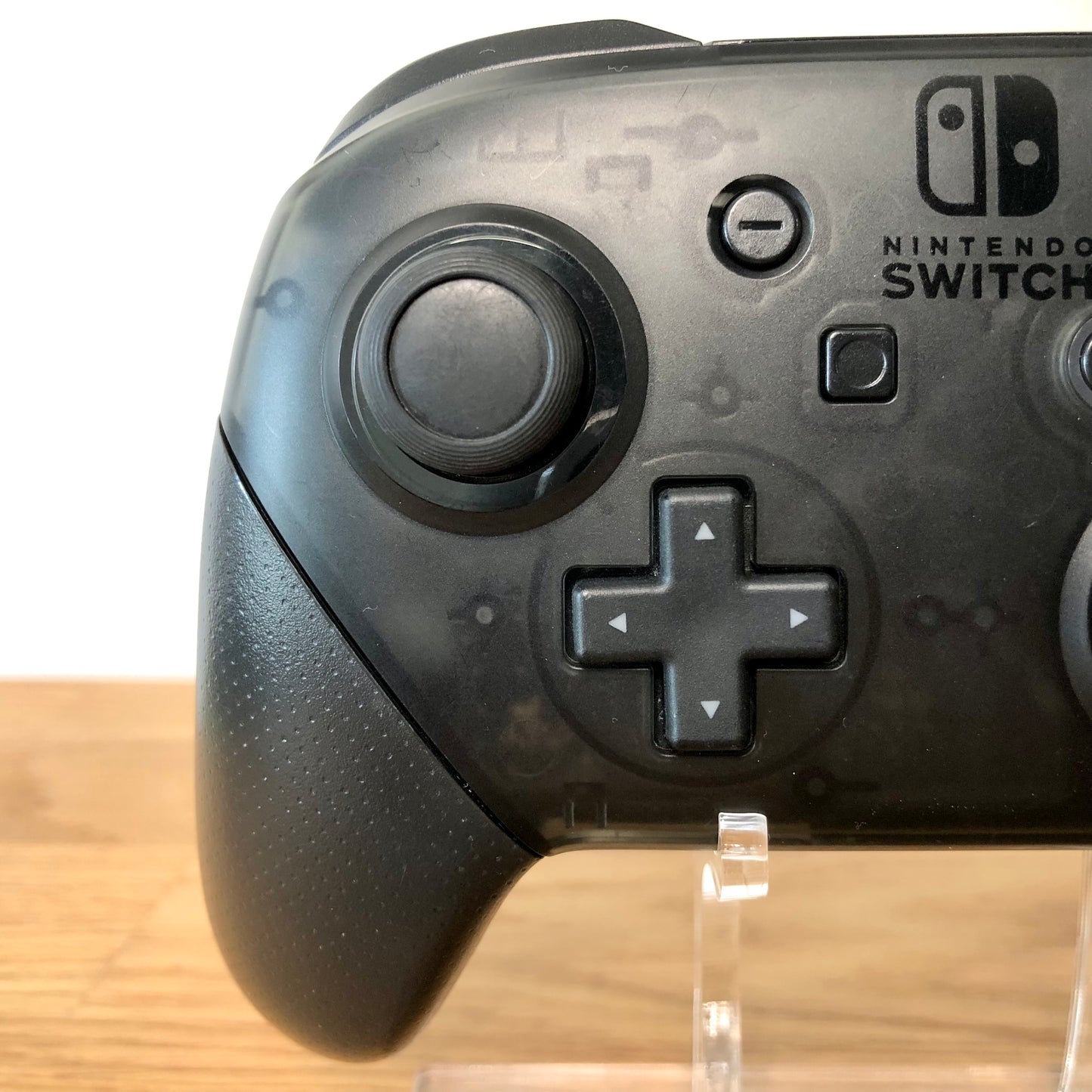 Close up view of Nintendo Switch Pro Controller left side. Highlighting the left side buttons condition.