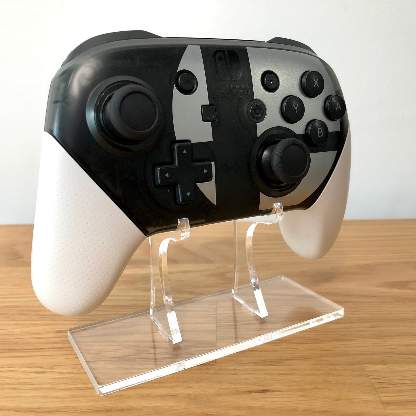 Front side view of Nintendo Switch Pro Smash Bros. Edition Controller, showing button layout and ergonomic design.