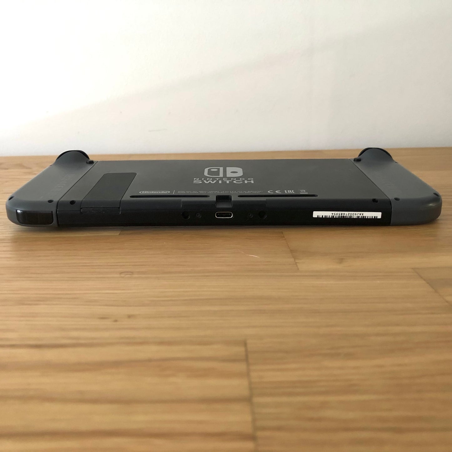 Bottom edge of Nintendo Switch console showing USB-C port, speaker vents and Joy-Con release buttons