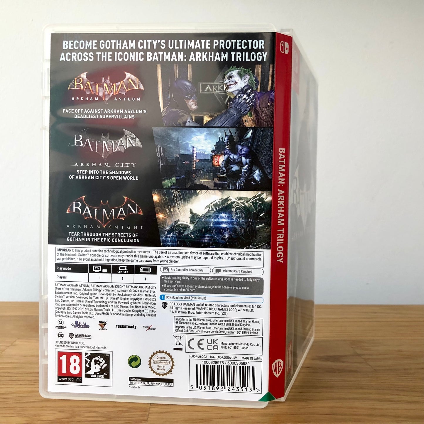 Angled view of Batman Arkham Trilogy Nintendo Switch case showing full back artwork