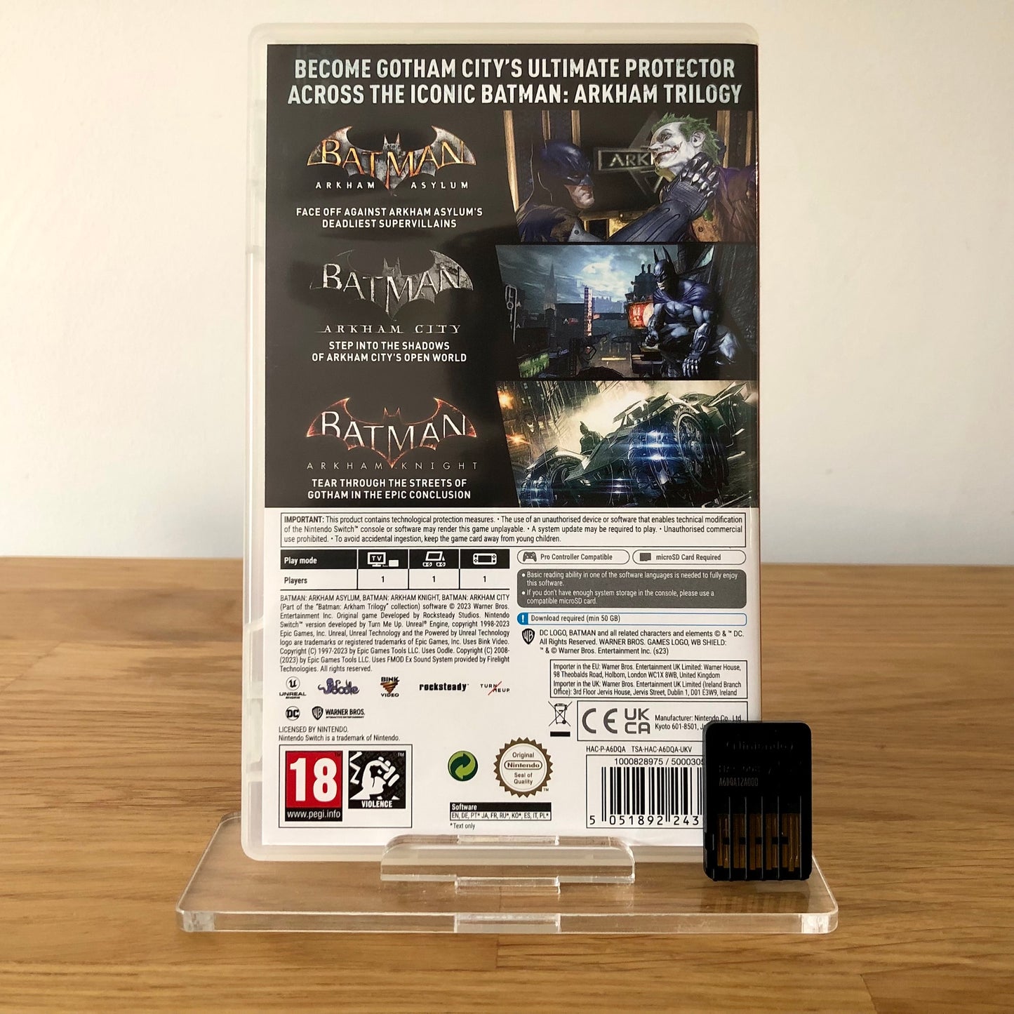 Batman Arkham Trilogy Nintendo Switch back cover with back of game cartridge in front