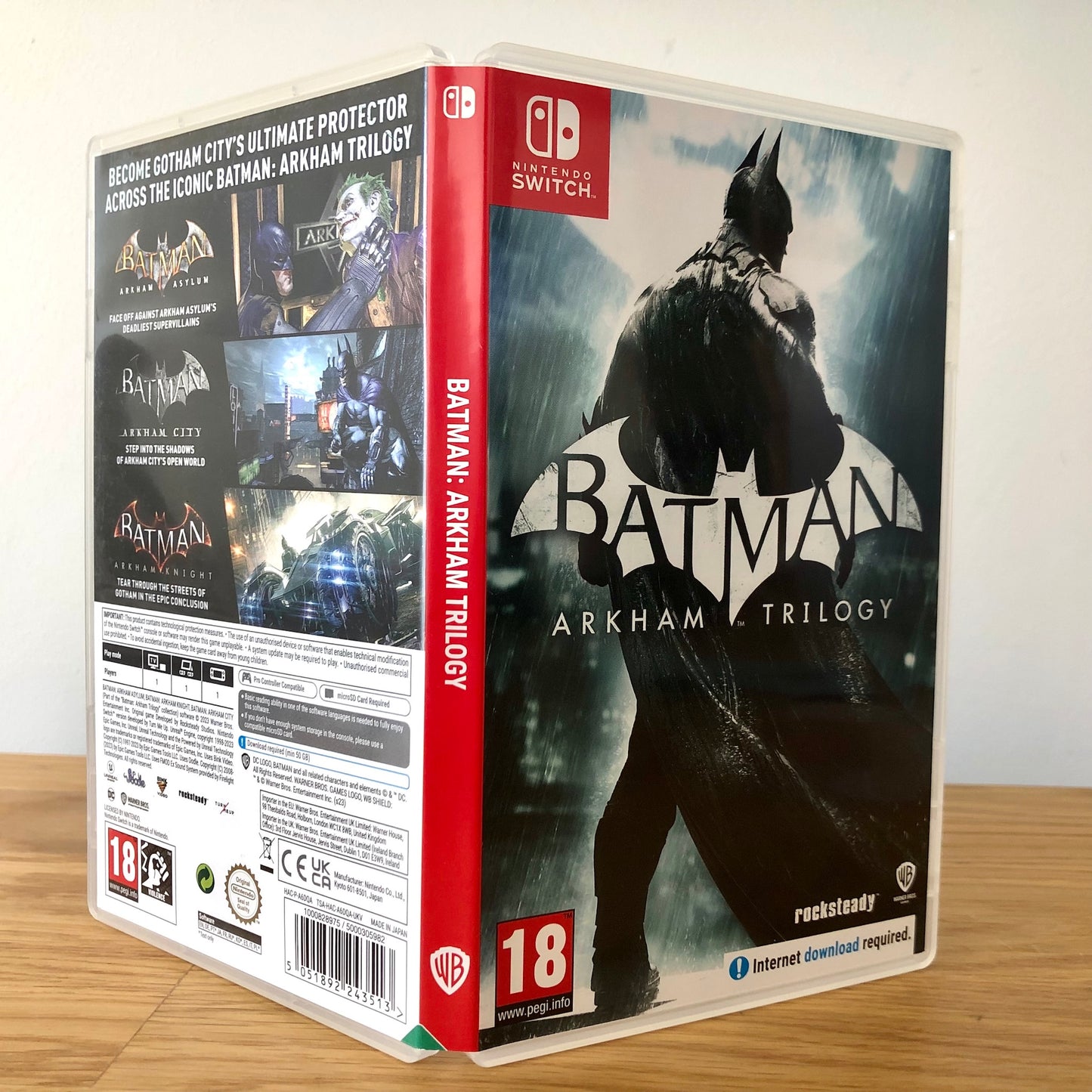 Angled view of Batman Arkham Trilogy Nintendo Switch case showing full front artwork