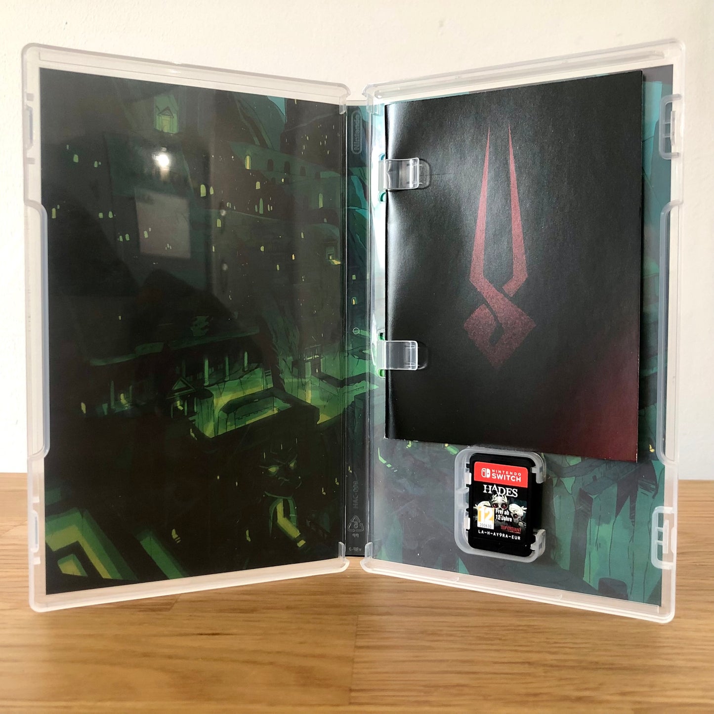 Inside the case of Hades for Nintendo Switch, showing the cartridge and case design.