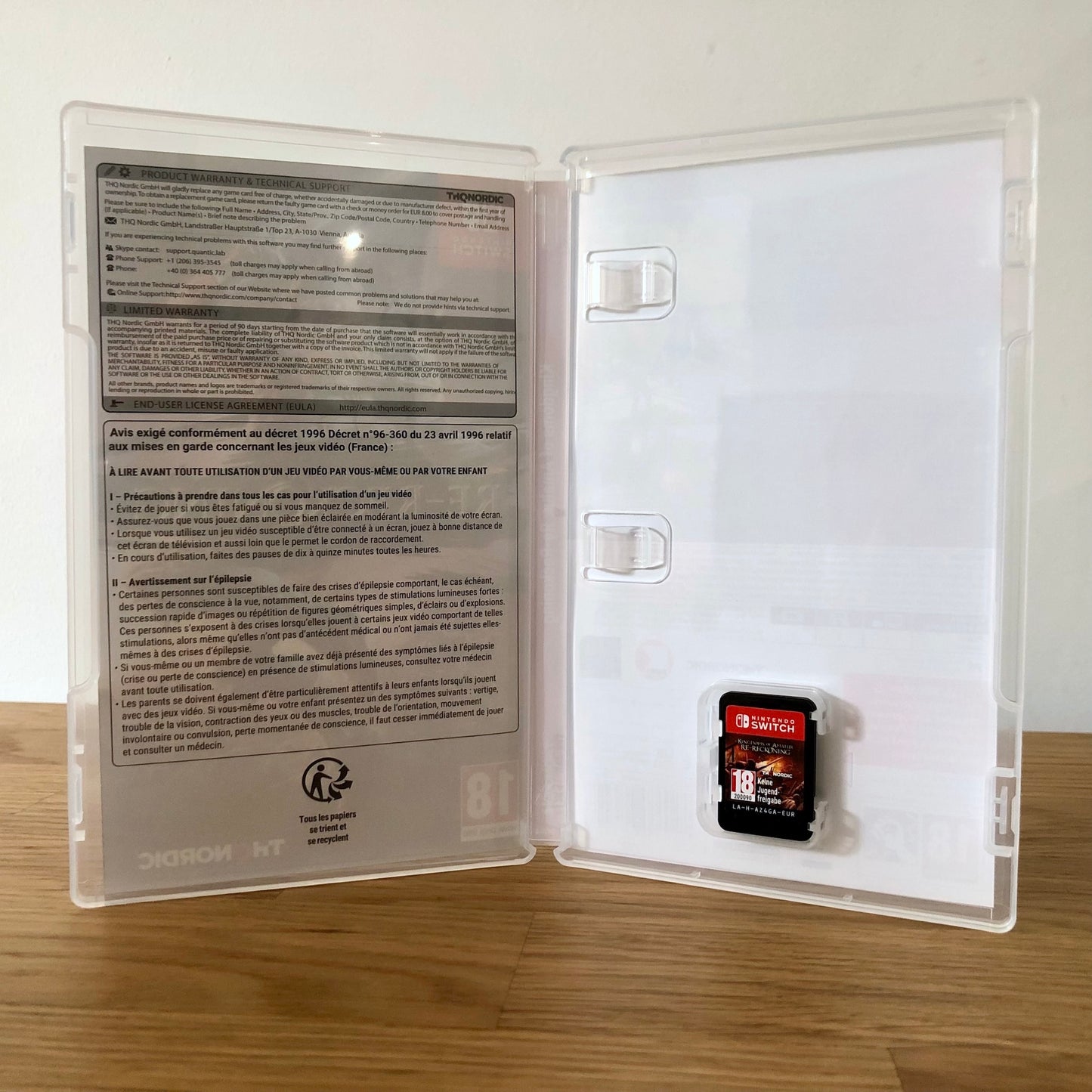 Inside the case of Kingdoms of Amalur: Re-Reckoning for Nintendo Switch, showing the cartridge and case design.