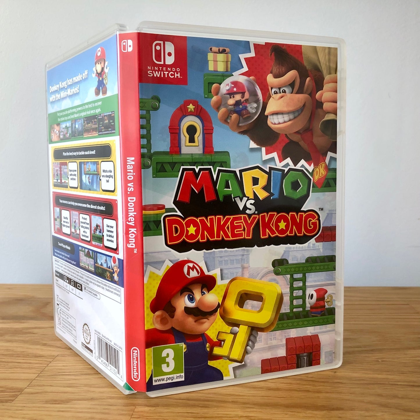 Angled front view of Mario vs Donkey Kong for Nintendo Switch, showing full front cover artwork.
