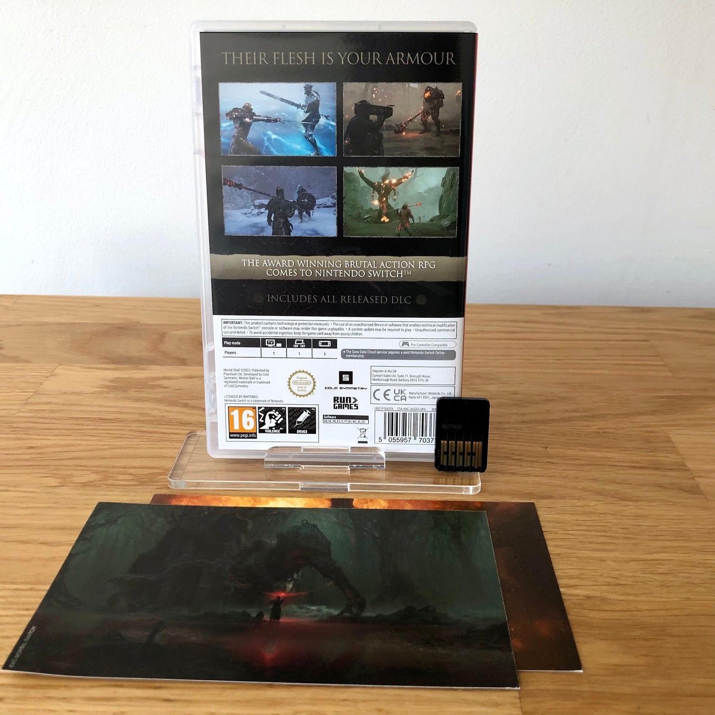 Back cover of Mortal Shell: Complete Edition for Nintendo Switch, showing game details, features, and back of cartridge.