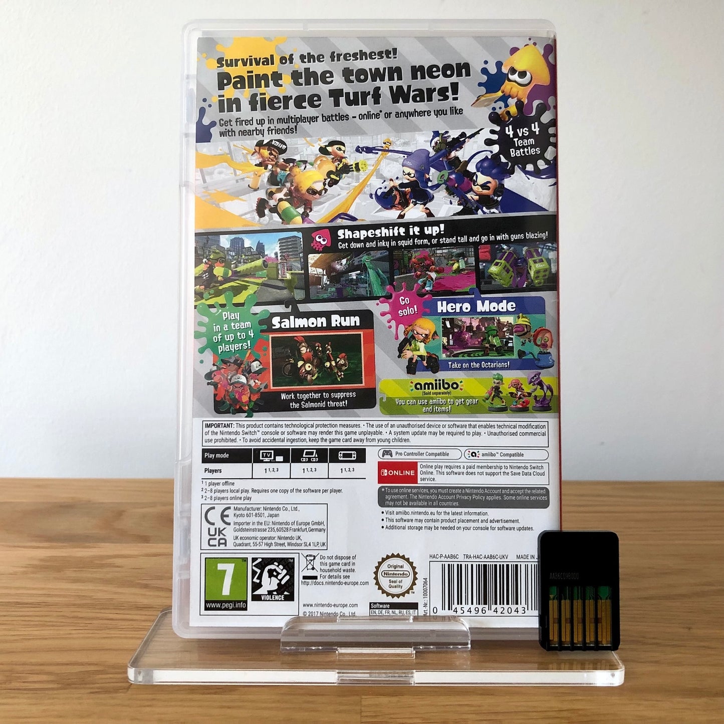 Back cover of Splatoon 2 for Nintendo Switch, showing game details, features, and back of cartridge.