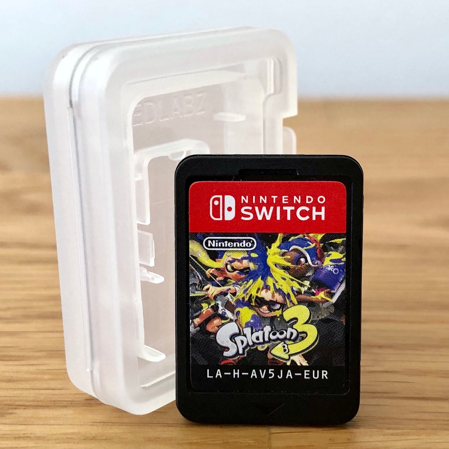 Front of Splatoon 3 Nintendo Switch game cartridge, showing the label design clearly.