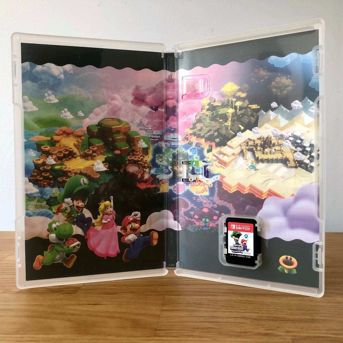 Inside the case of Super Mario Bros. Wonder for Nintendo Switch, showing the cartridge and case design.