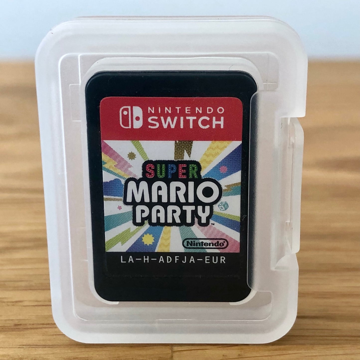 Super Mario Party Nintendo Switch cartridge inside a transparent protective case, showing the front of the cartridge.