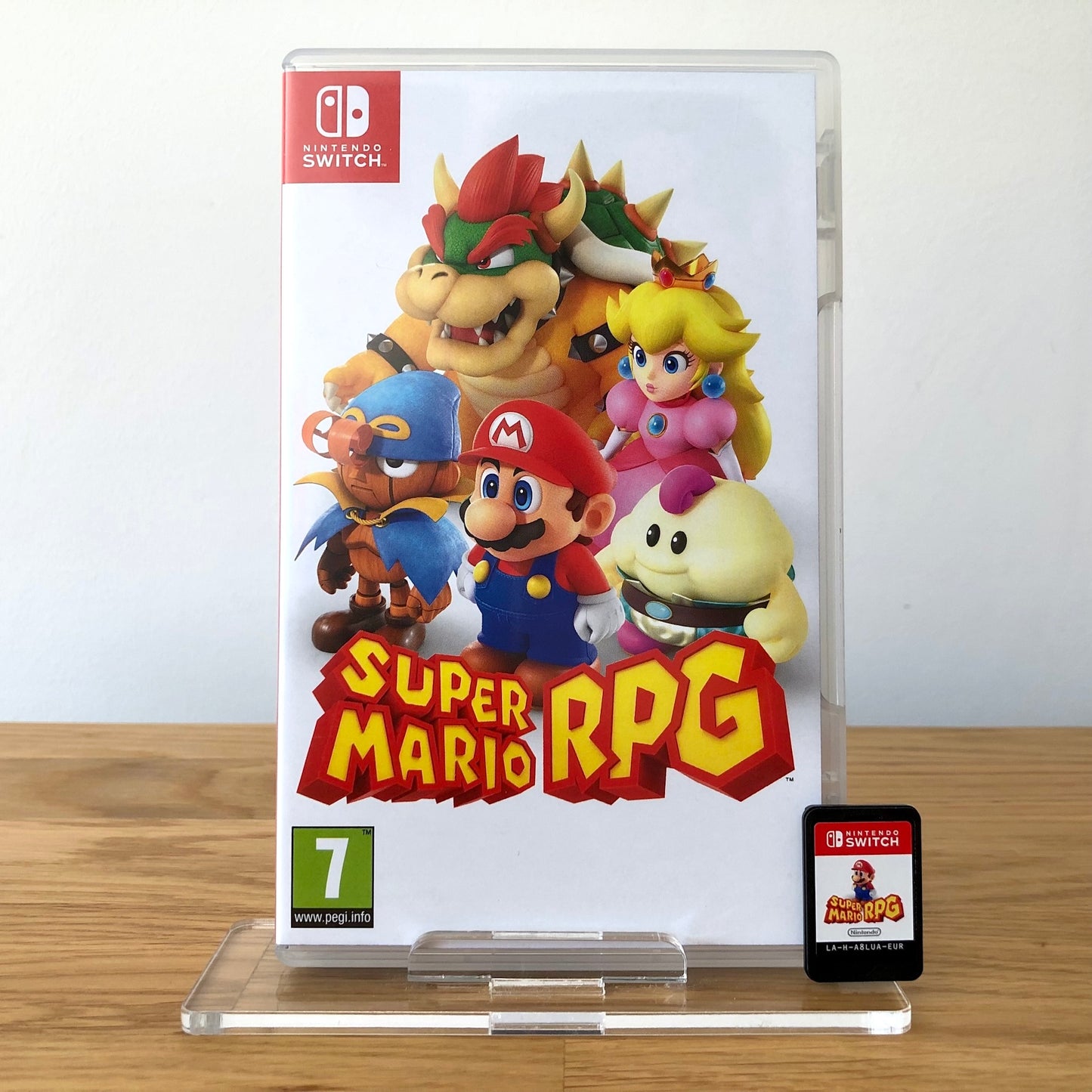 Front cover of Super Mario RPG for Nintendo Switch, featuring game artwork, title, and front of cartridge.