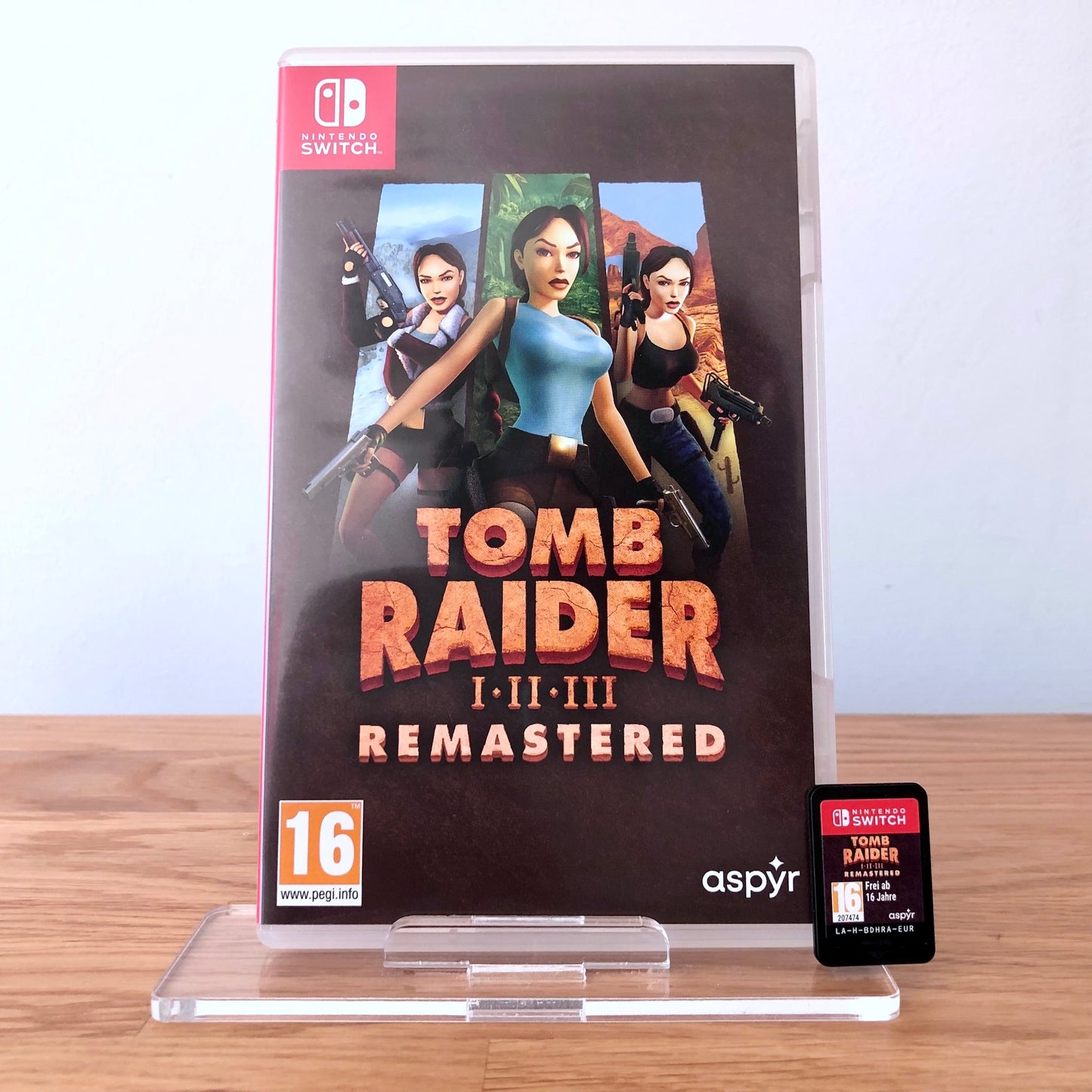 Front cover of Tomb Raider I–III Remastered for Nintendo Switch, featuring game artwork, title, and front of cartridge.
