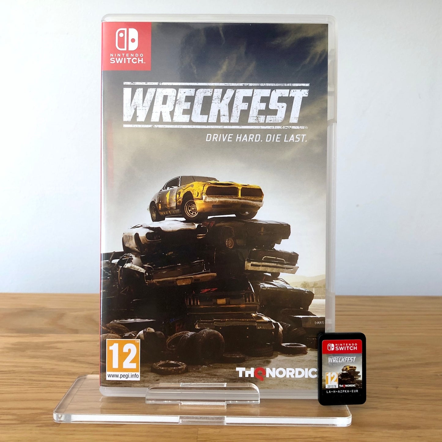 Front cover of Wreckfest for Nintendo Switch, featuring game artwork, title, and front of cartridge.
