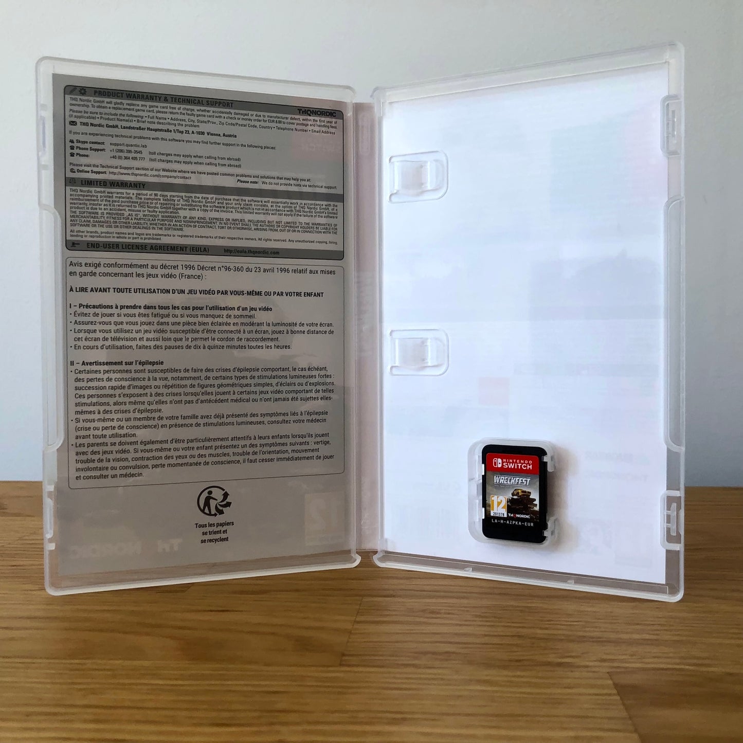 Inside the case of Wreckfest for Nintendo Switch, showing the cartridge and case design.