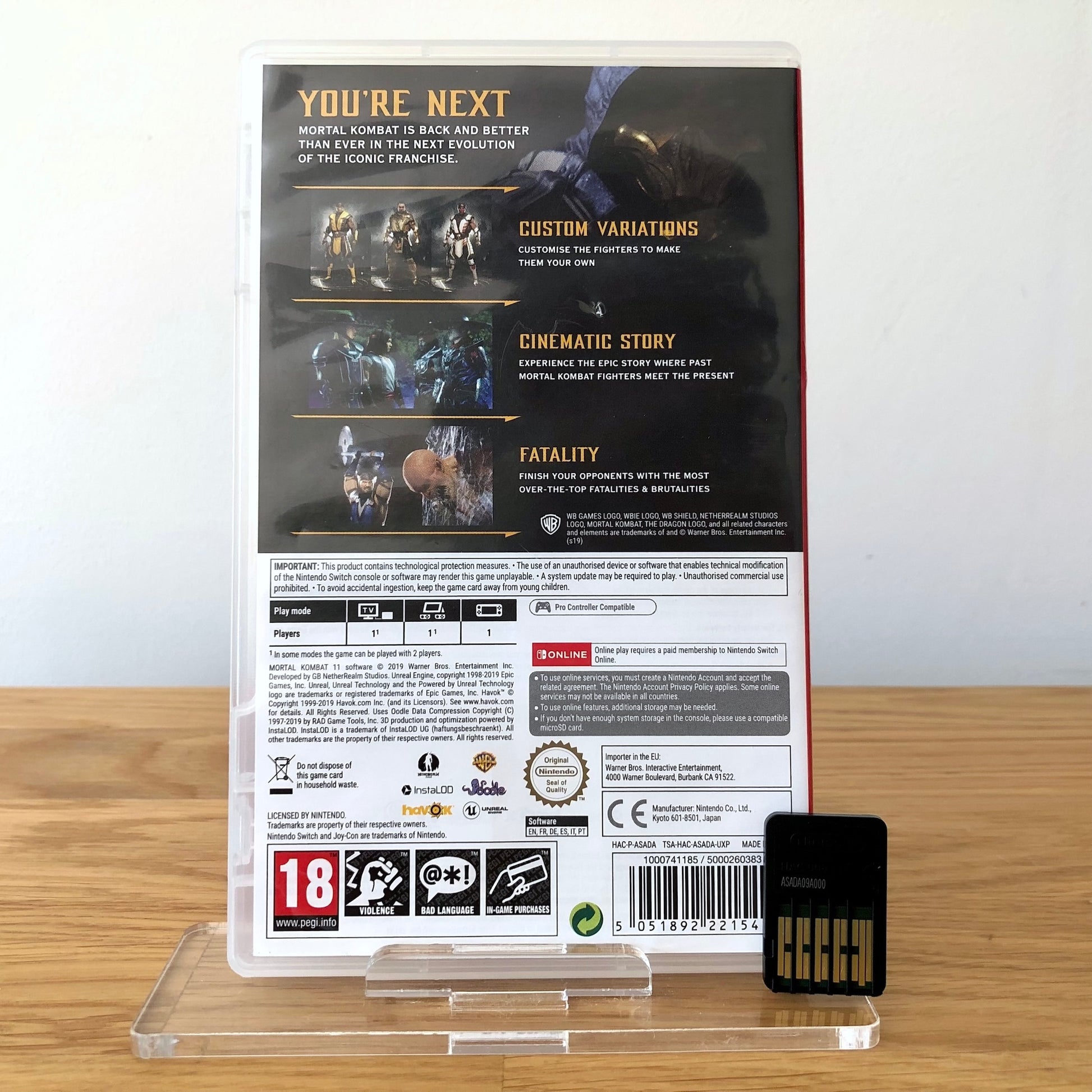 Back cover of Mortal Kombat 11 for Nintendo Switch, showing game details, features, and back of cartridge.