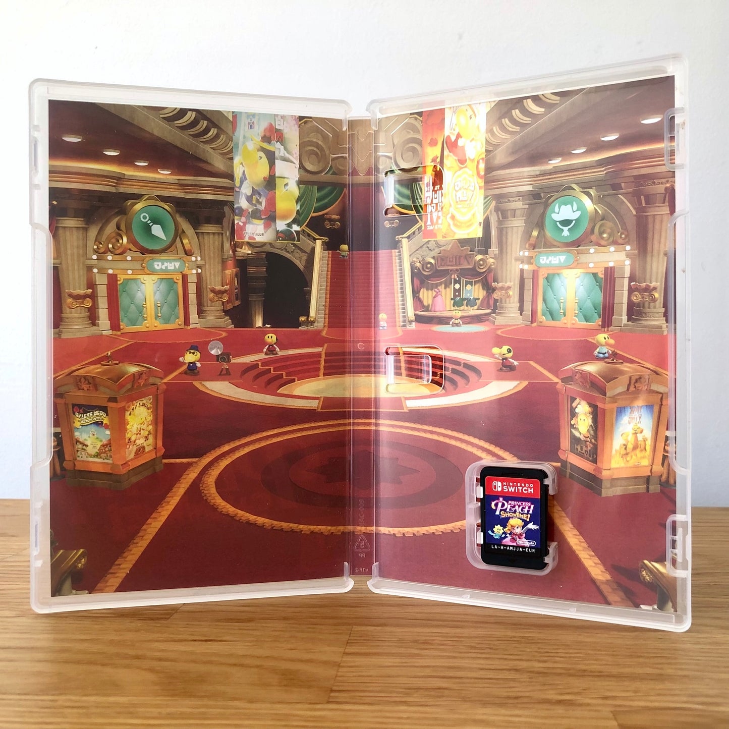 Inside the case of Princess Peach Showtime! for Nintendo Switch, showing the cartridge and case design.