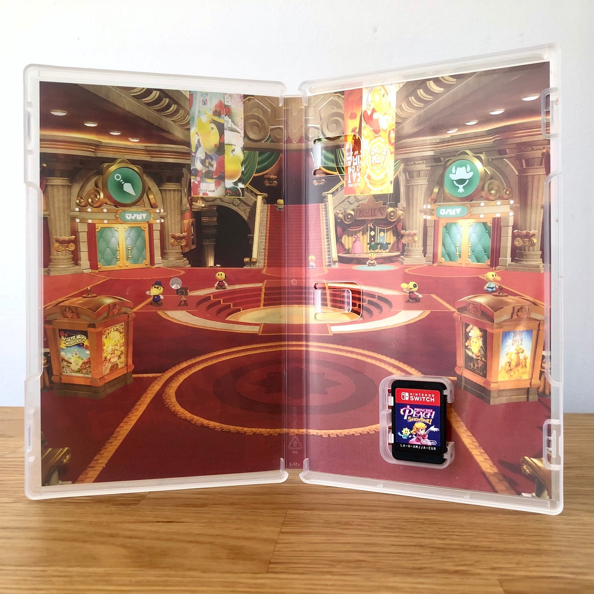Inside the case of Princess Peach Showtime! for Nintendo Switch, showing the cartridge and case design.