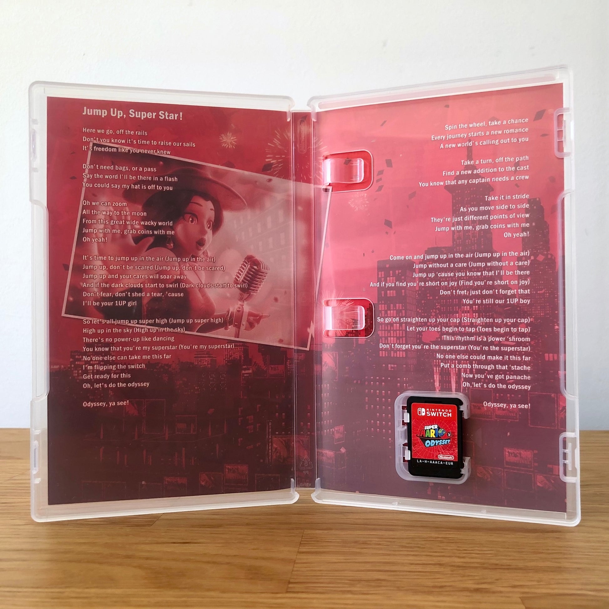 Inside the case of Super Mario Odyssey for Nintendo Switch, showing the cartridge and case design.