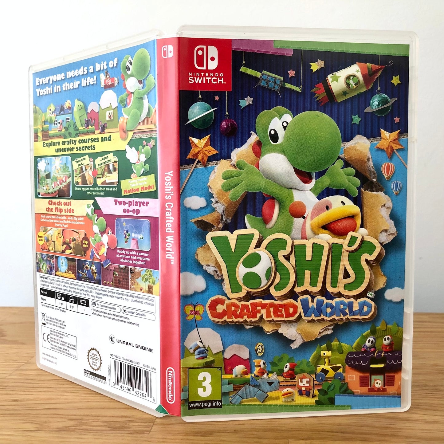 Angled front view of Yoshi's Crafted World for Nintendo Switch, showing full front cover artwork.