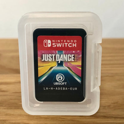 Cartridge of Just Dance 2019 for Nintendo Switch, the cartridge is inside a cartridge size transparent protective case, through which you can see the front of the cartridge