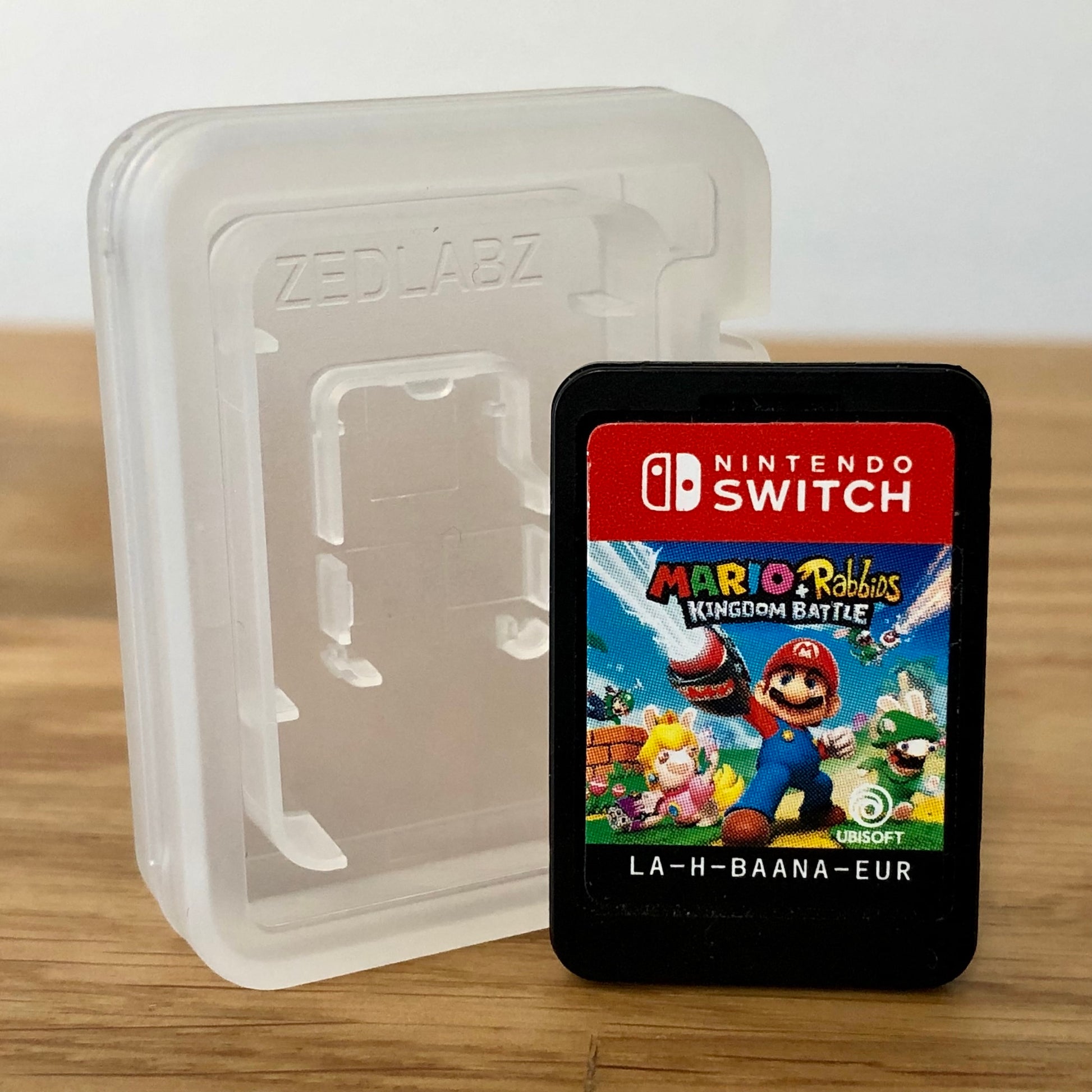 Cartridge front of Mario + Rabbids Kingdom Battle for Nintendo Switch, featuring game title.